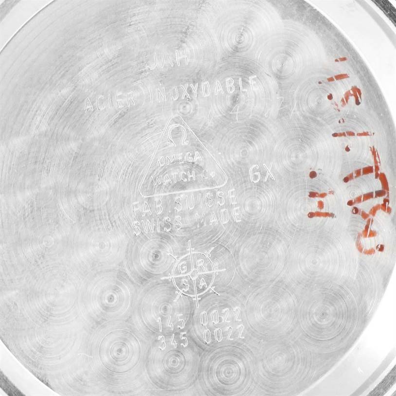 The image shows the inner caseback of the Omega Speedmaster 3570.50.00 Men
s Stainless Steel Black Dial 3570.50.00 Men
s Stainless Steel Black Dial watch, featuring engravings and markings.