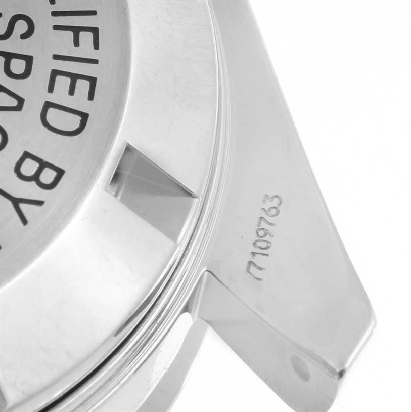 The image shows the back case and lugs of an Omega Speedmaster 3570.50.00 Men
s Stainless Steel Black Dial 3570.50.00 Men
s Stainless Steel Black Dial watch, highlighting the engraved text and serial number.