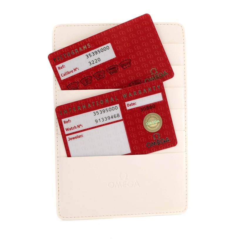 The image shows warranty and pictogram cards for the Omega Speedmaster 3539.50.00 Men
s Stainless Steel Black Dial 3539.50.00 Men
s Stainless Steel Black Dial, partially inserted into a white cardholder.