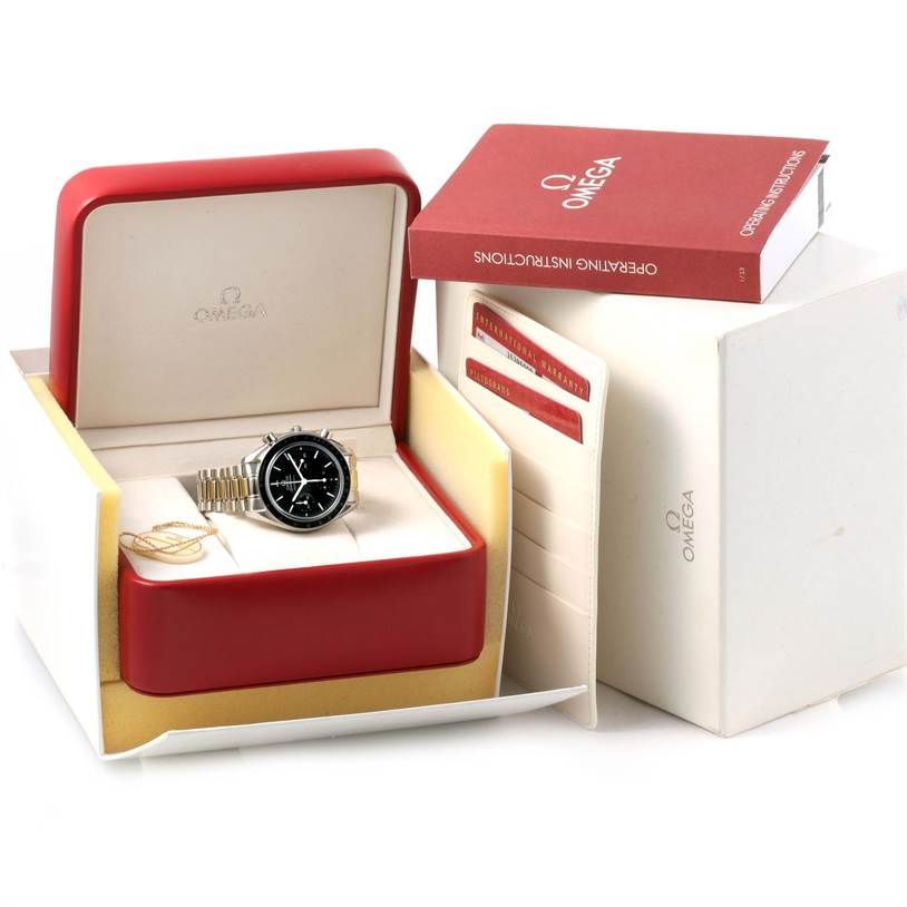 The Omega Speedmaster 3539.50.00 Men
s Stainless Steel Black Dial 3539.50.00 Men
s Stainless Steel Black Dial watch is shown in its open box along with operating instructions and a warranty card.
