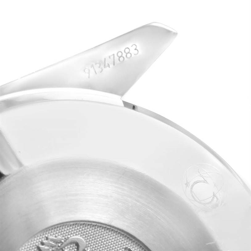 This image shows a close-up of the back cover of an Omega Speedmaster 3539.50.00 Men
s Stainless Steel Black Dial 3539.50.00 Men
s Stainless Steel Black Dial watch, highlighting the serial number and part of the logo.