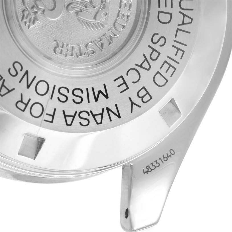 The image shows the case back of an Omega Speedmaster 3590.50.00 Men
s Stainless Steel Black Dial 3590.50.00 Men
s Stainless Steel Black Dial watch with a focus on the engravings and serial number.