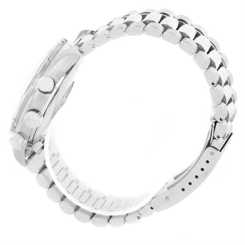 This image shows the Omega Speedmaster 3510.82.00 Men
s Stainless Steel Blue Dial 3510.82.00 Men
s Stainless Steel Blue Dial watch from a side angle, highlighting its buttons, crown, and metal bracelet.