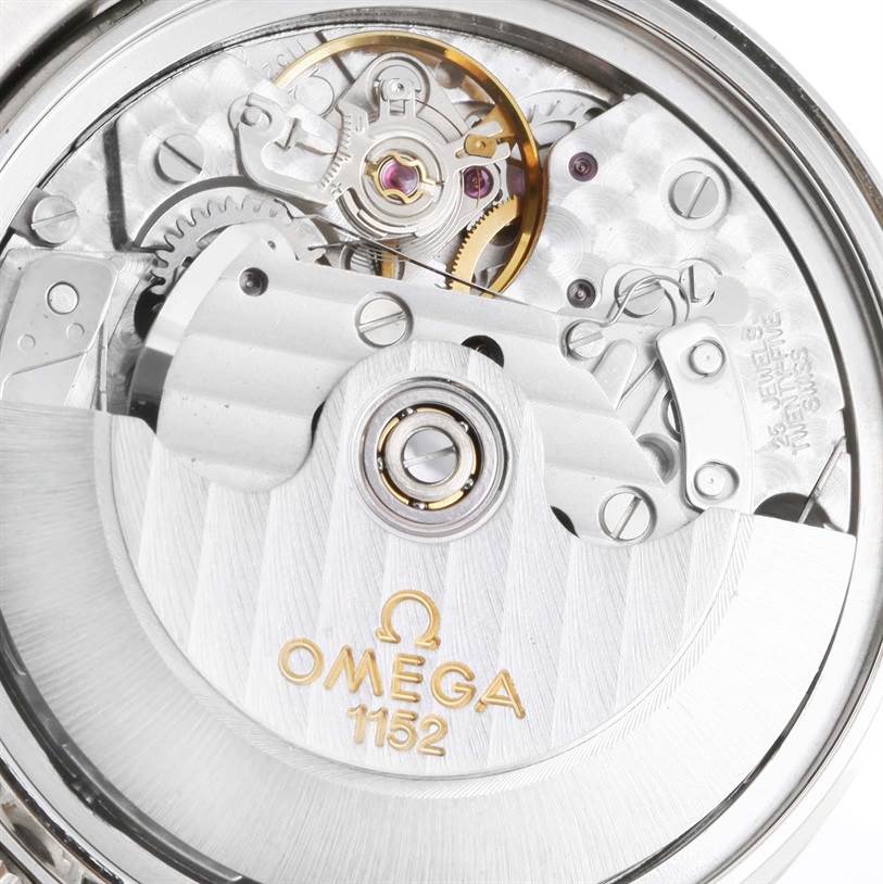 This is a close-up of the Omega Speedmaster 3513.82.00 Men
s Stainless Steel Blue Dial 3513.82.00 Men
s Stainless Steel Blue Dial watch movement showing gears, balance wheel and "Omega 1152" engraving.