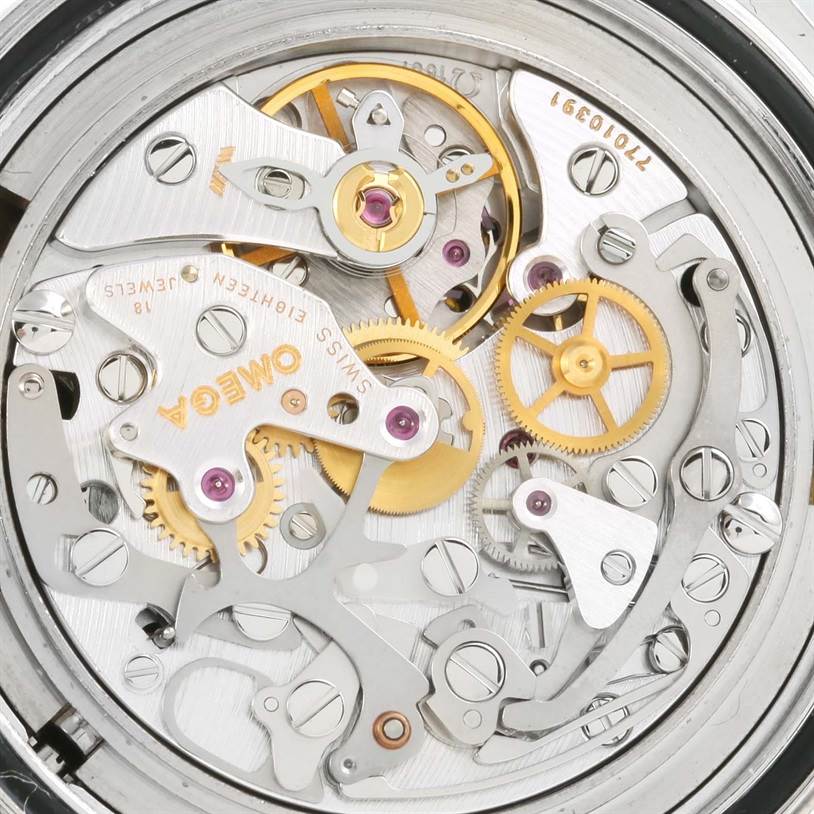 This image shows the intricate internal mechanics of the Omega Speedmaster 3560.50.00 Men
s Stainless Steel Black Dial 3560.50.00 Men
s Stainless Steel Black Dial watch from a close-up, top-down angle.