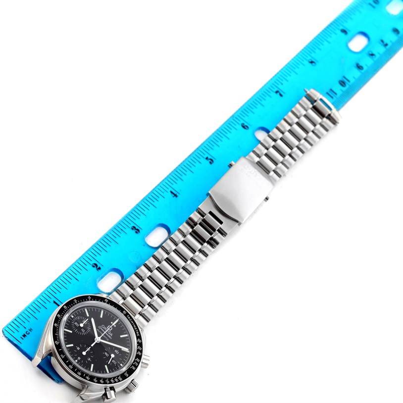 The image shows an Omega Speedmaster 3539.50.00 Men
s Stainless Steel Black Dial 3539.50.00 Men
s Stainless Steel Black Dial watch with a stainless steel band, measured with a blue ruler from an overhead angle.
