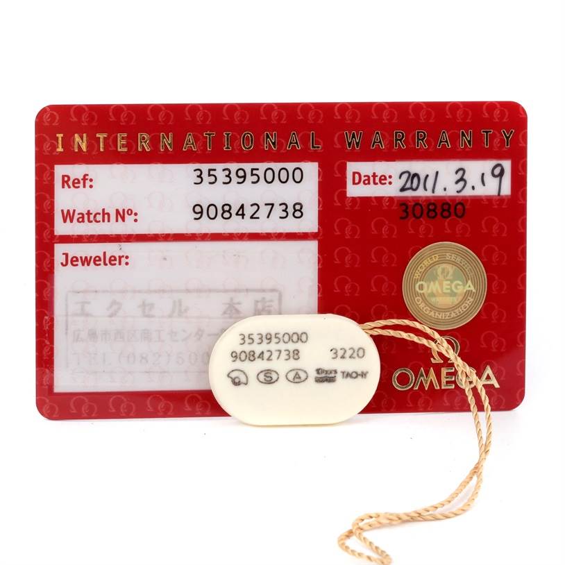 The image shows the International Warranty card and a hang tag for the Omega Speedmaster 3539.50.00 Men
s Stainless Steel Black Dial 3539.50.00 Men
s Stainless Steel Black Dial watch.