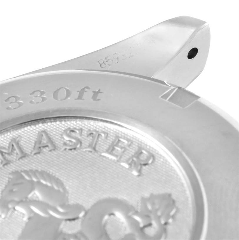 This image shows a close-up view of the back case and lug of the Omega Speedmaster 3212.80.00 Men
s Stainless Steel Blue Dial 3212.80.00 Men
s Stainless Steel Blue Dial, highlighting the "330ft" marking.