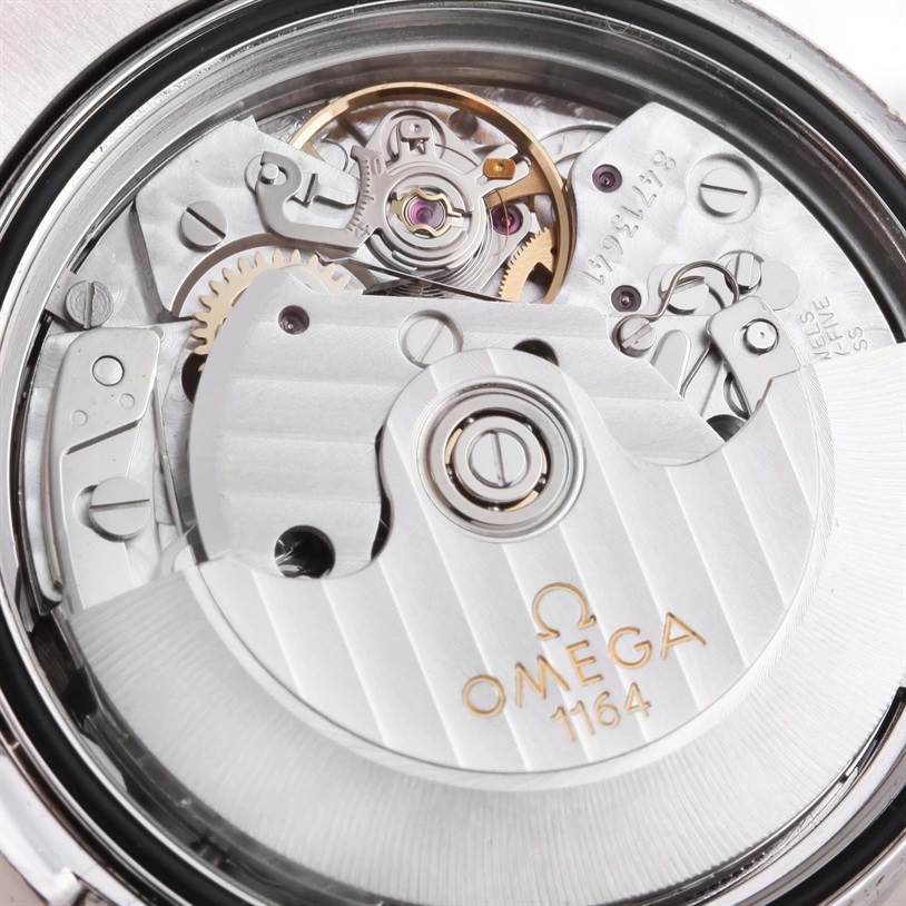 The image shows a close-up view of the Omega Speedmaster 3212.80.00 Men
s Stainless Steel Blue Dial 3212.80.00 Men
s Stainless Steel Blue Dial
s automatic movement mechanism.