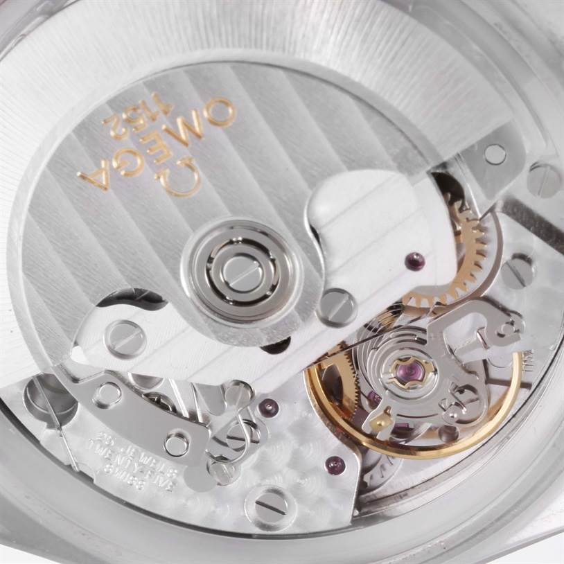 The image shows a close-up view of the movement mechanism of an Omega Speedmaster 3513.50.00 Men
s Stainless Steel Black Dial 3513.50.00 Men
s Stainless Steel Black Dial watch, highlighting its intricate gears and components.