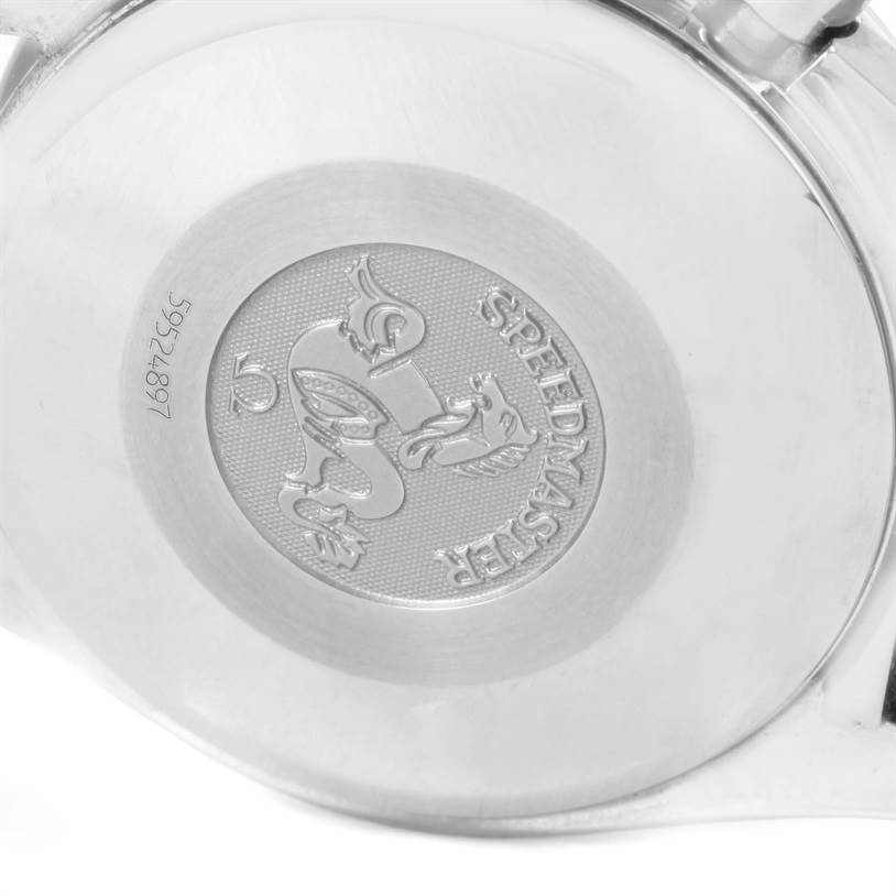 The image shows the backside of an Omega Speedmaster 3513.50.00 Men
s Stainless Steel Black Dial 3513.50.00 Men
s Stainless Steel Black Dial watch, highlighting its engraved emblem and serial number.