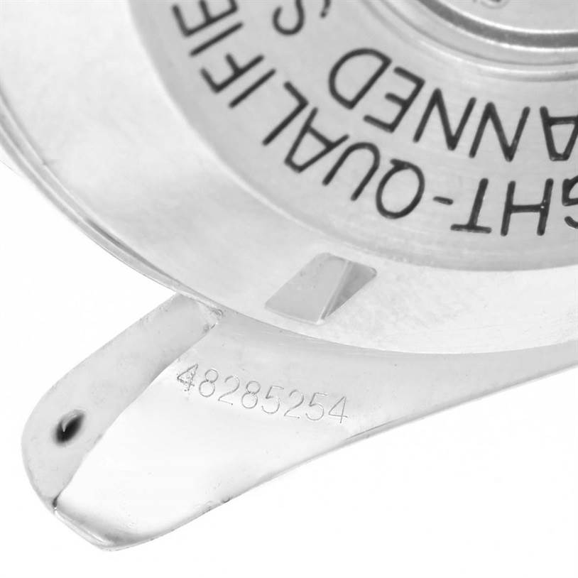 The image shows a close-up of the Omega Speedmaster 3590.50.00 Men
s Stainless Steel Black Dial 3590.50.00 Men
s Stainless Steel Black Dial
s case back with model details and a part of the lug with a serial number.