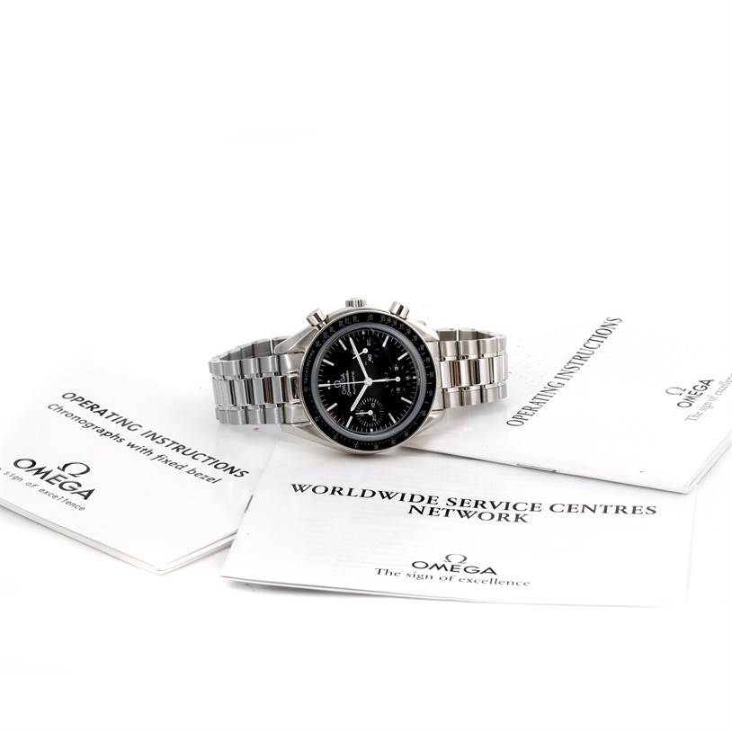 The Omega Speedmaster 3539.50.00 Men's Stainless Steel Black Dial 3539.50.00 Men's Stainless Steel Black Dial watch is shown in a frontal view with its stainless steel bracelet, accompanied by operating manuals.