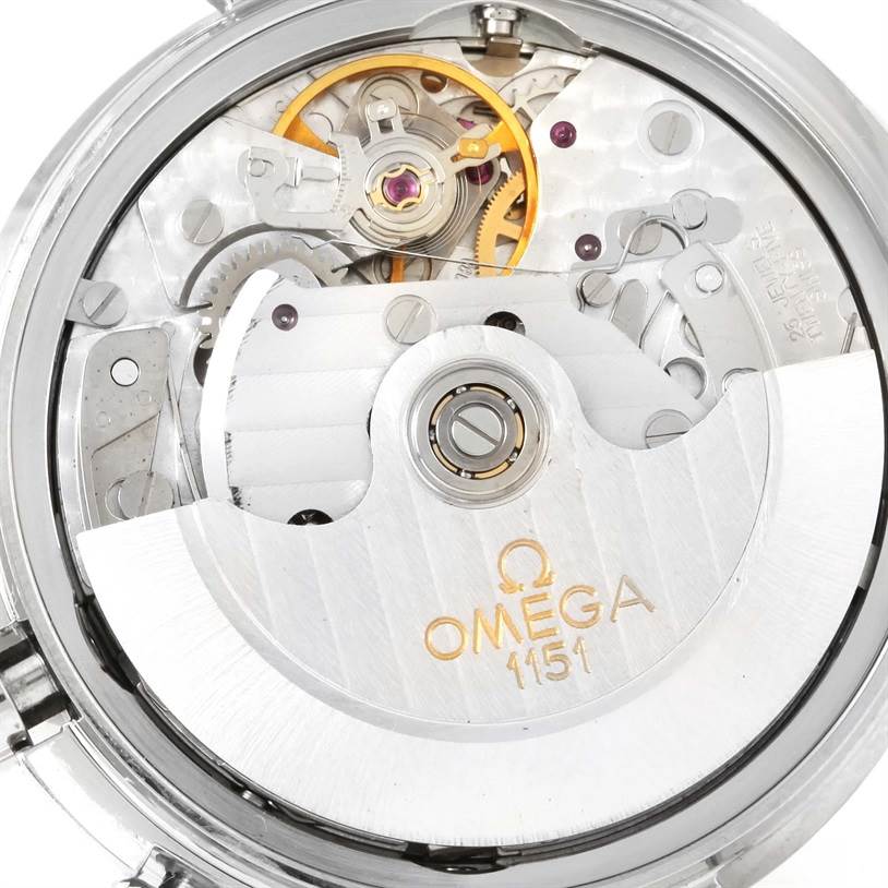 This image shows the intricate inner workings of an Omega Speedmaster 3520.50.00 Men
s Stainless Steel Black Dial 3520.50.00 Men
s Stainless Steel Black Dial watch, including the movement and engraved details.