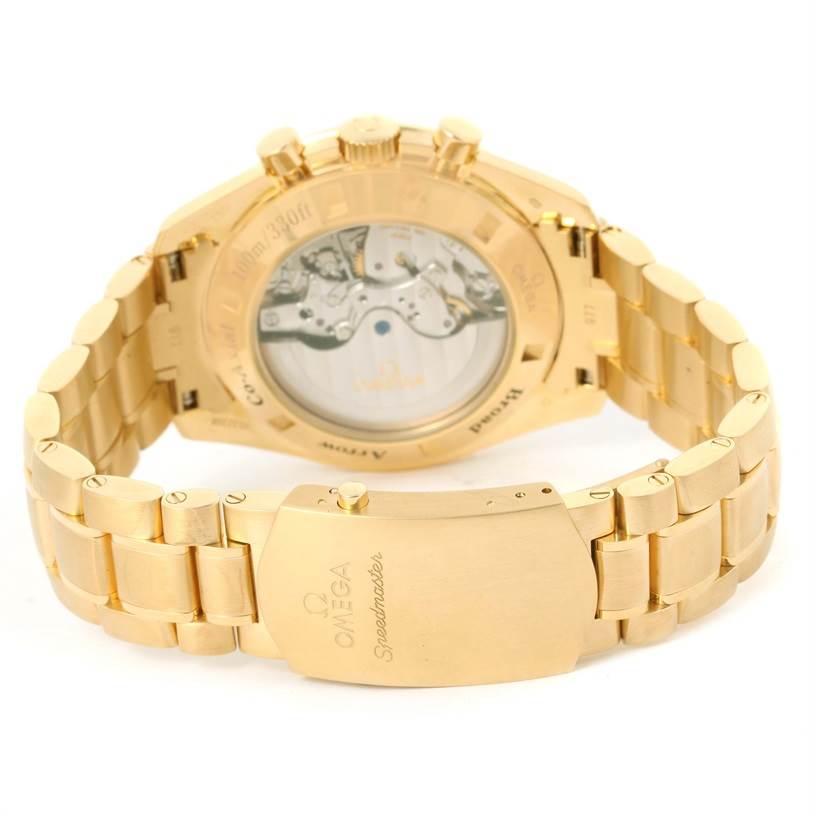 The image shows the backside and bracelet of an Omega Speedmaster 321.50.42.50.02.001 Men's Yellow Gold Silver Dial 321.50.42.50.02.001 Men's Yellow Gold Silver Dial gold watch, highlighting the clasp and movement through the case back.