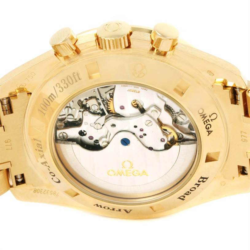 The image shows the backside of the Omega Speedmaster 321.50.42.50.02.001 Men's Yellow Gold Silver Dial 321.50.42.50.02.001 Men's Yellow Gold Silver Dial watch, highlighting its exposed movement and case-back details.