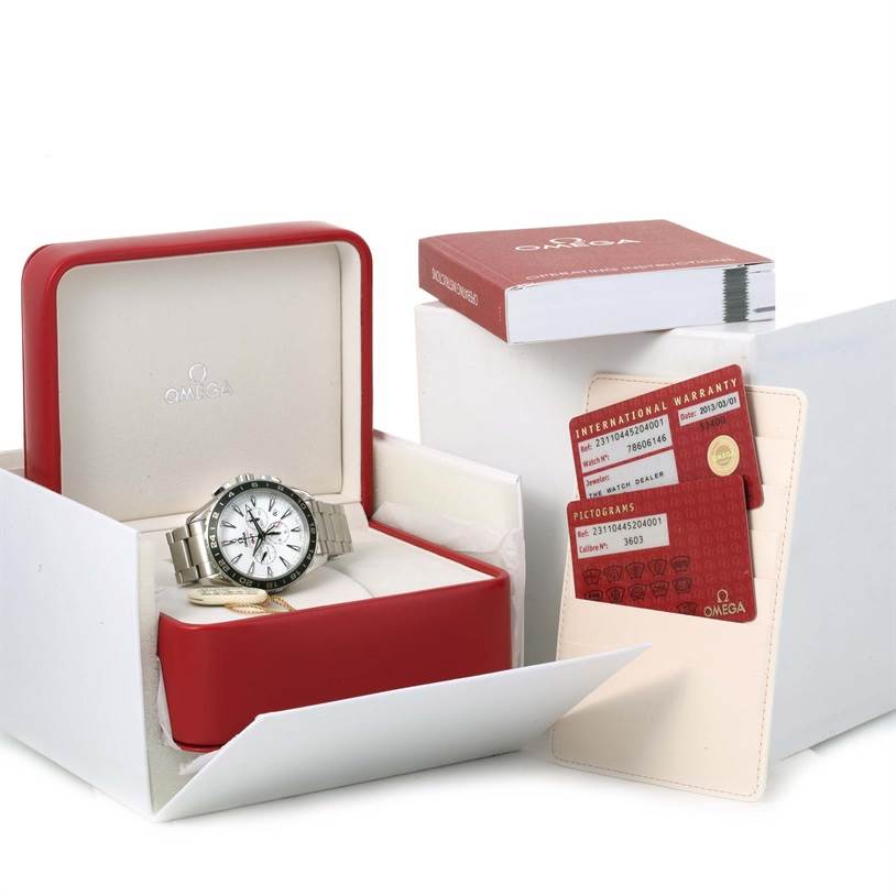 The image shows an Omega Speedmaster 231.10.44.52.04.001 Men
s Stainless Steel White Dial 231.10.44.52.04.001 Men
s Stainless Steel White Dial watch in a red and white box, alongside the warranty card and a booklet.