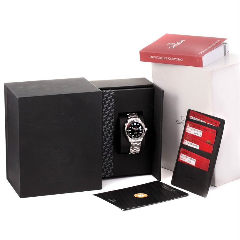 The image shows an Omega Speedmaster 212.30.41.20.01.005 Men
s Stainless Steel Black Dial 212.30.41.20.01.005 Men
s Stainless Steel Black Dial watch from a front angle, including its box, warranty cards, and instruction manual.