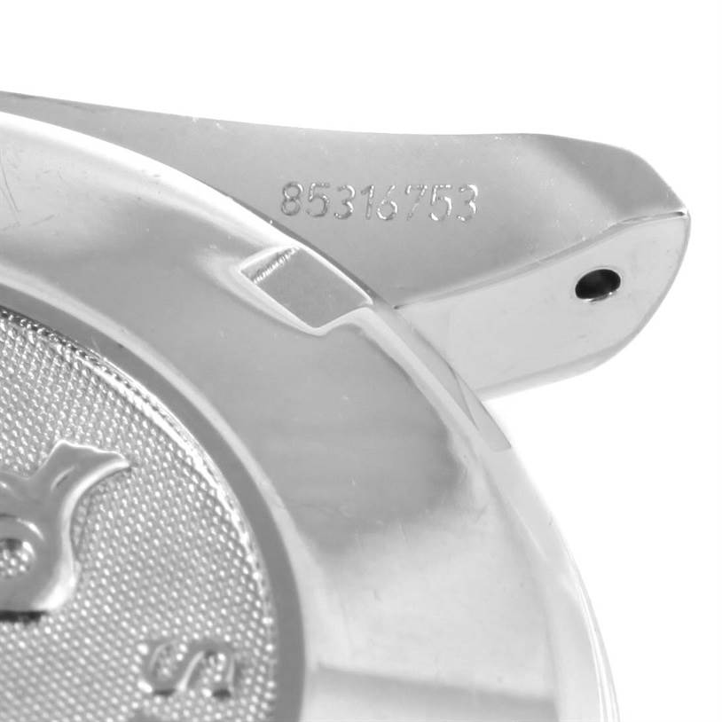 This image shows a close-up of the serial number and partial case back of an Omega Speedmaster 3211.31.00 Men
s Stainless Steel Silver Dial 3211.31.00 Men
s Stainless Steel Silver Dial watch.