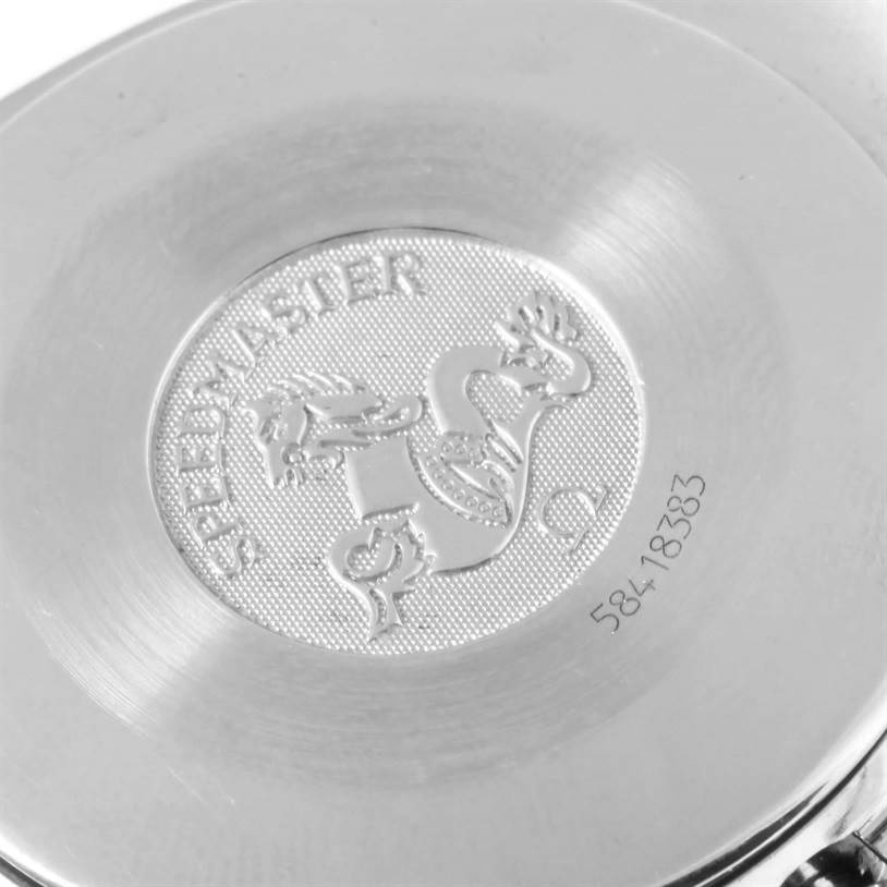 The image shows the back case of an Omega Speedmaster 3510.82.00 Men
s Stainless Steel Blue Dial 3510.82.00 Men
s Stainless Steel Blue Dial watch with its engraved logo and serial number.