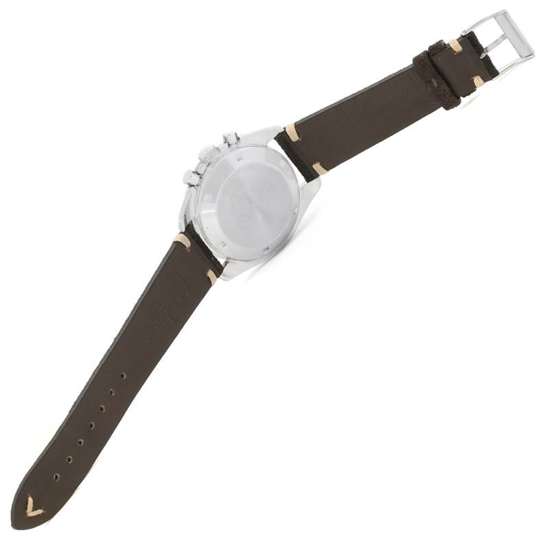 The Omega Speedmaster 145.022 Men
s Stainless Steel Black Dial 145.022 Men
s Stainless Steel Black Dial watch is shown from the backside, displaying its case back and a brown leather strap with a buckle.