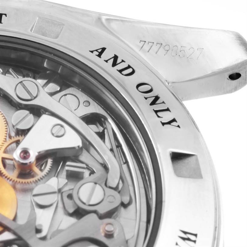 The image shows a close-up of the Omega Speedmaster 311.30.42.30.13.001 Men's Stainless Steel Brown Dial 311.30.42.30.13.001 Men's Stainless Steel Brown Dial's movement and case back, highlighting its intricate gears and the inscription on the rim.