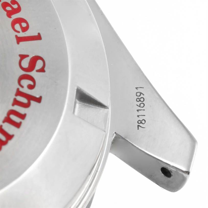 The image shows a close-up of the back and lug area of an Omega Speedmaster 3506.61.00 Men's Stainless Steel Red Dial 3506.61.00 Men's Stainless Steel Red Dial watch, including part of the caseback and serial number.