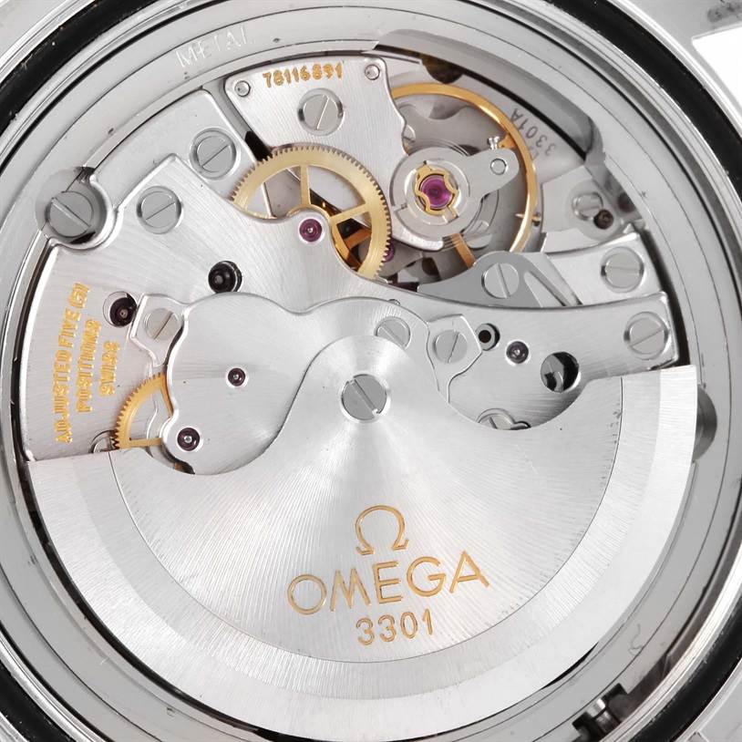 The image shows the intricate movement and internal mechanisms of the Omega Speedmaster 3506.61.00 Men's Stainless Steel Red Dial 3506.61.00 Men's Stainless Steel Red Dial watch from a back angle.