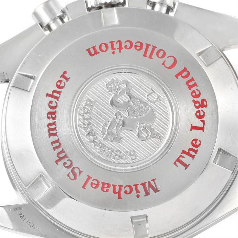 The image shows the back case of an Omega Speedmaster 3506.61.00 Men's Stainless Steel Red Dial 3506.61.00 Men's Stainless Steel Red Dial watch, featuring engraved text and emblem.