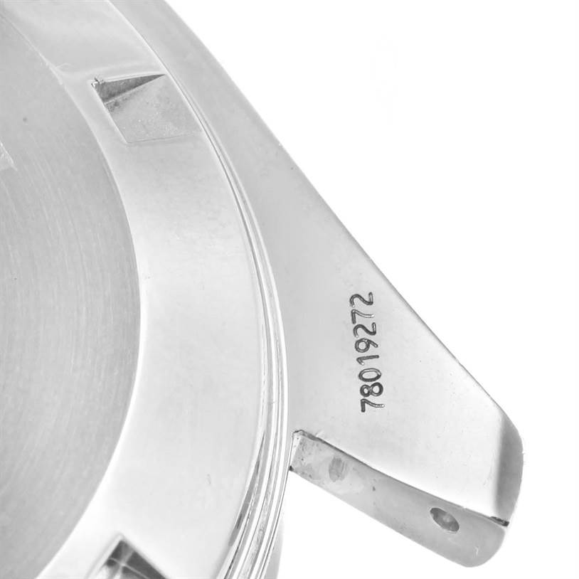 The image shows a partial view of the back case and lugs of an Omega Speedmaster 3551.50.00 Men
s Stainless Steel Black Dial 3551.50.00 Men
s Stainless Steel Black Dial watch, with visible serial numbers.