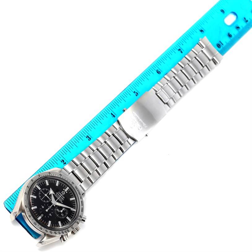 The Omega Speedmaster 3551.50.00 Men
s Stainless Steel Black Dial 3551.50.00 Men
s Stainless Steel Black Dial watch is shown from a top-down angle with a focus on the face and bracelet measured against a ruler.