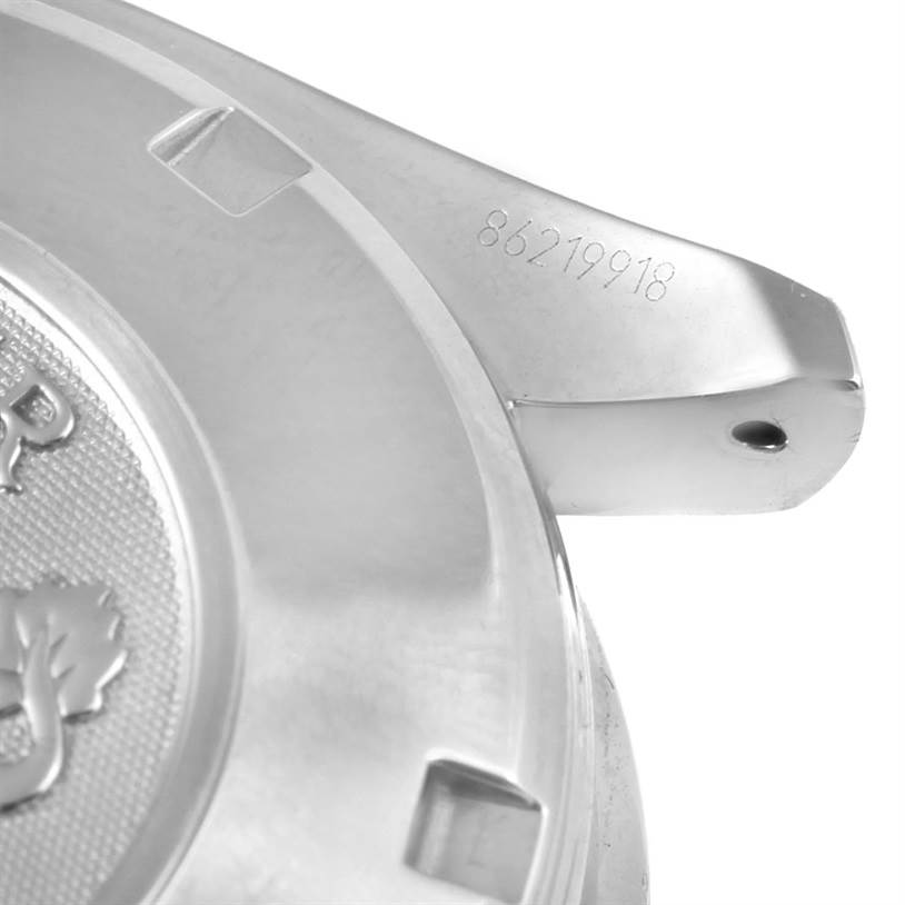 The image shows a close-up of the case back and lug of an Omega Speedmaster 3212.80.00 Men
s Stainless Steel Blue Dial 3212.80.00 Men
s Stainless Steel Blue Dial watch, with part of the serial number visible.