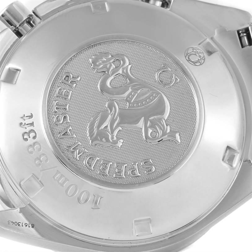 This image shows the case back of an Omega Speedmaster 81613043 Men
s Stainless Steel Black Dial 81613043 Men
s Stainless Steel Black Dial watch, featuring an engraved emblem and text.