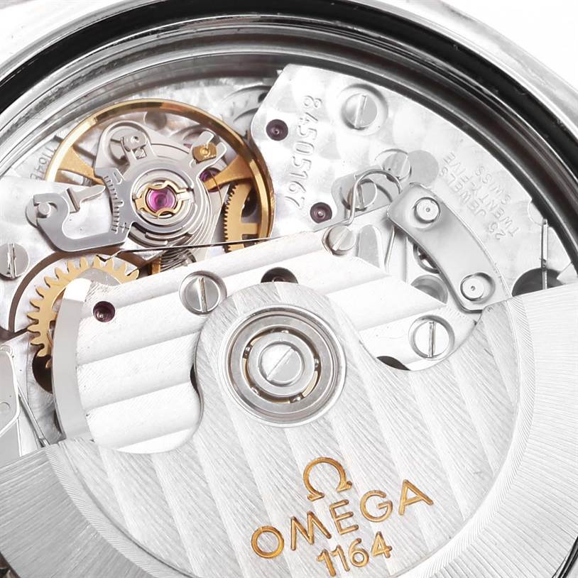 The image shows the movement mechanism of the Omega Speedmaster 3210.52.00 Men
s Stainless Steel Black Dial 3210.52.00 Men
s Stainless Steel Black Dial watch, focusing on its intricate gears and rotor.