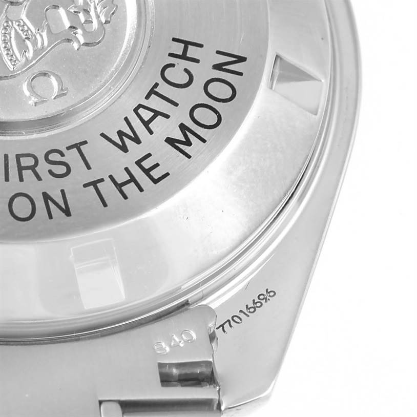 The image shows the back cover of an Omega Speedmaster 3570.50.00 Men
s Stainless Steel Black Dial 3570.50.00 Men
s Stainless Steel Black Dial watch, highlighting the inscription "First Watch On The Moon."