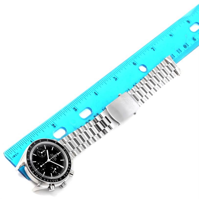 The Omega Speedmaster 3539.50.00 Men
s Stainless Steel Black Dial 3539.50.00 Men
s Stainless Steel Black Dial watch is shown laid flat with a blue ruler for measurement.