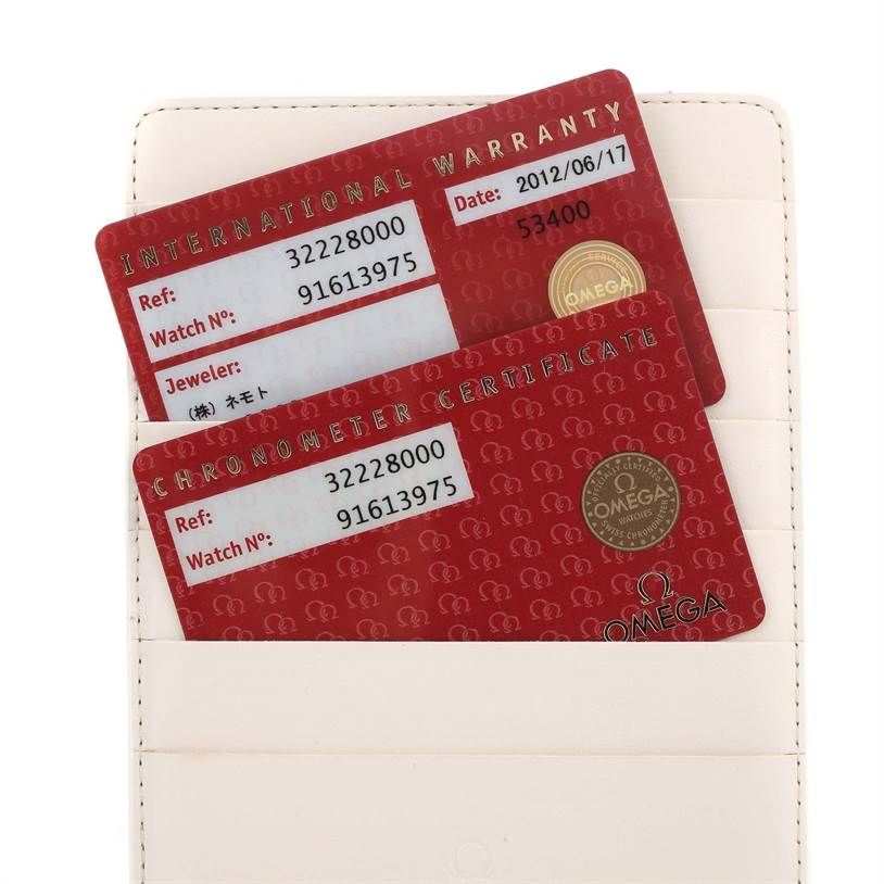 This image shows the warranty and certification cards for an Omega Speedmaster 3222.80.00 Men
s Stainless Steel Blue Dial 3222.80.00 Men
s Stainless Steel Blue Dial watch in a cardholder.