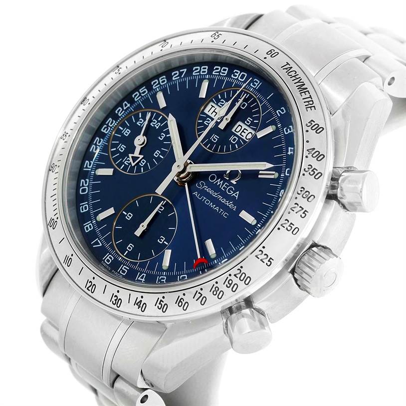 The image shows an Omega Speedmaster 3523.80.00 Men
s Stainless Steel Blue Dial 3523.80.00 Men
s Stainless Steel Blue Dial watch at an angle, highlighting its blue dial, tachymeter bezel, and chronograph pushers.