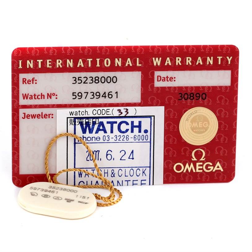 The image shows the international warranty card and tag for an Omega Speedmaster 3523.80.00 Men
s Stainless Steel Blue Dial 3523.80.00 Men
s Stainless Steel Blue Dial watch.