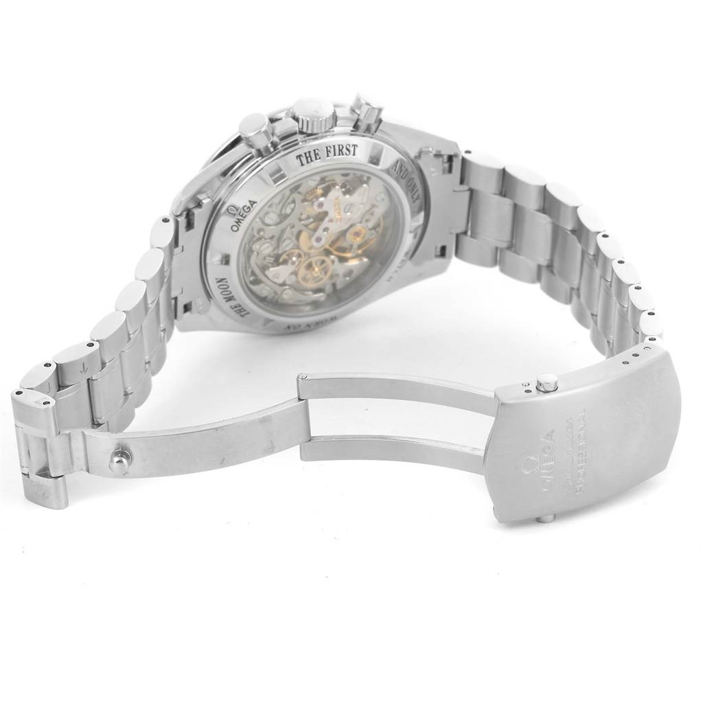 The image shows the back view of an Omega Speedmaster 3573.50.00 Men
s Stainless Steel Black Dial 3573.50.00 Men
s Stainless Steel Black Dial watch, highlighting its open case back and stainless steel bracelet with clasp.