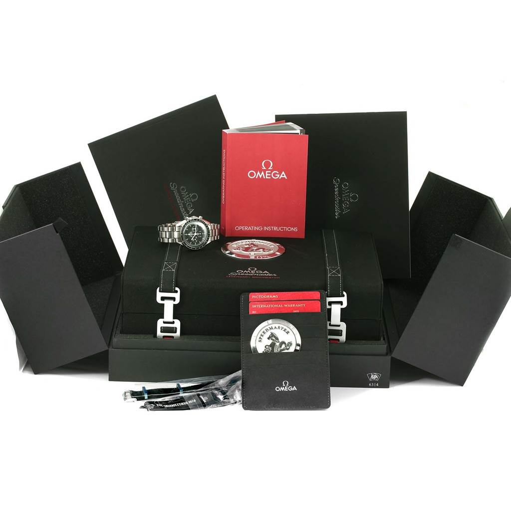 The Omega Speedmaster 311.30.42.30.01.005 Men
s Stainless Steel Black Dial 311.30.42.30.01.005 Men
s Stainless Steel Black Dial watch is shown along with its box, operating instructions, warranty card, and additional accessories.