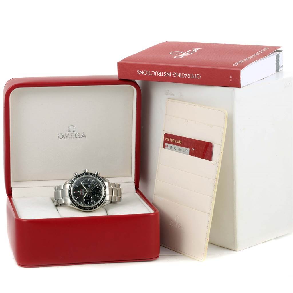 The Omega Speedmaster 323.30.40.40.06.001 Men's Stainless Steel Grey Dial 323.30.40.40.06.001 Men's Stainless Steel Grey Dial watch is shown front-facing in a red box with its operating instructions and a card holder.