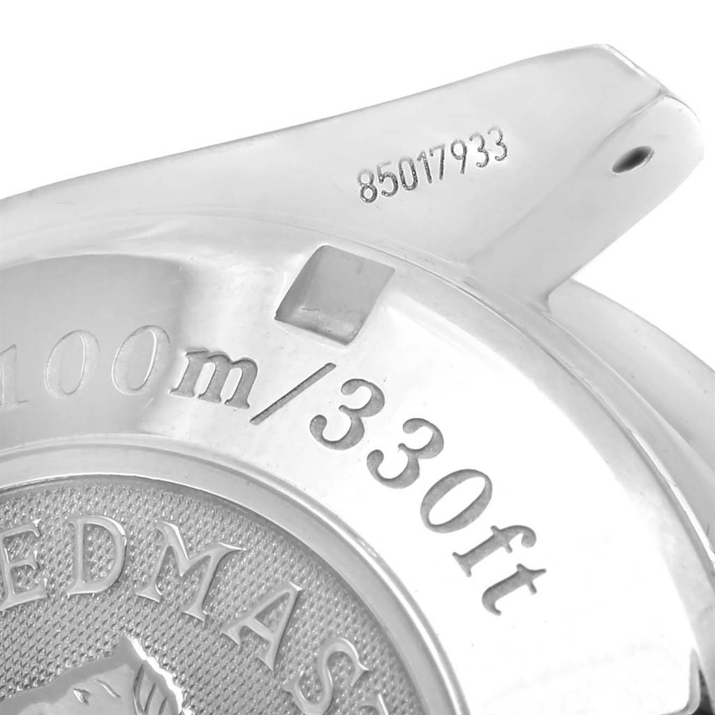 This image shows the back case of an Omega Speedmaster 3211.31.00 Men
s Stainless Steel Silver Dial 3211.31.00 Men
s Stainless Steel Silver Dial watch, including markings for water resistance and the serial number.