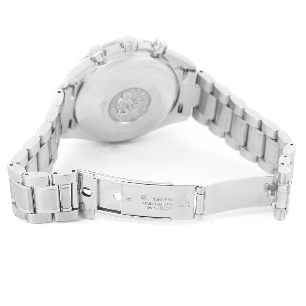 The image shows the back case and open clasp of an Omega Speedmaster 3513.50.00 Men's Stainless Steel Black Dial 3513.50.00 Men's Stainless Steel Black Dial watch, revealing the stainless steel bracelet and inscriptions inside the clasp.