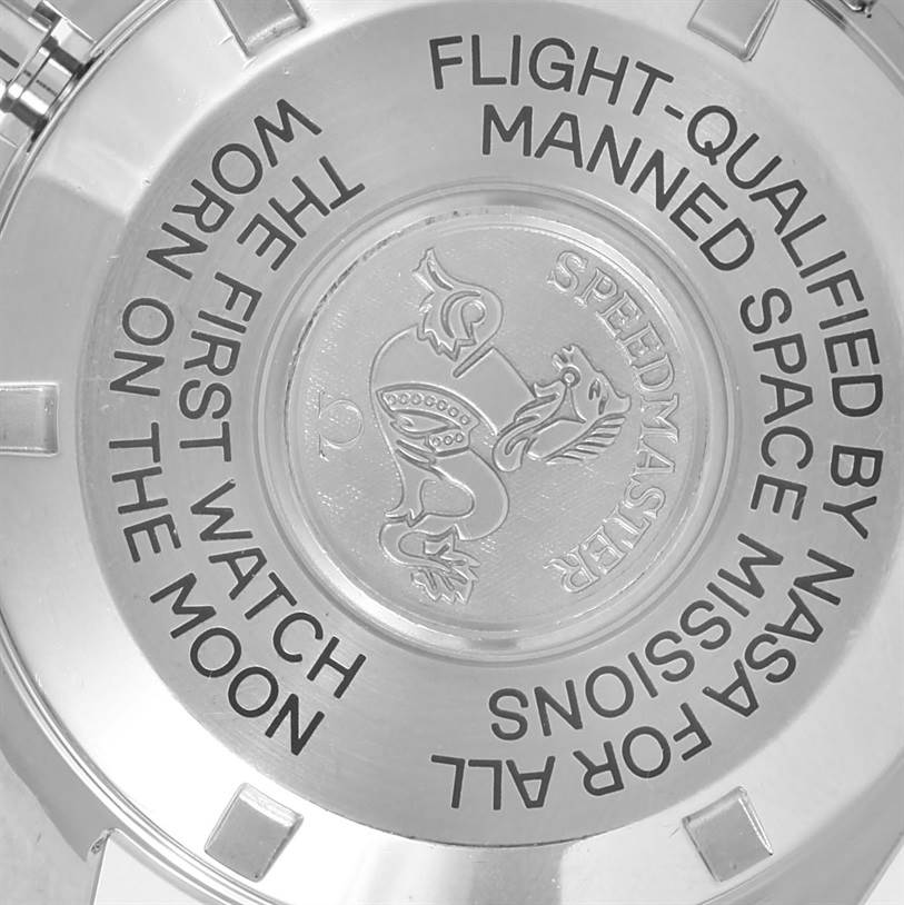 The image shows the back case of an Omega Speedmaster 3570.50.00 Men
s Stainless Steel Black Dial 3570.50.00 Men
s Stainless Steel Black Dial watch, highlighting its engraved text and emblem.