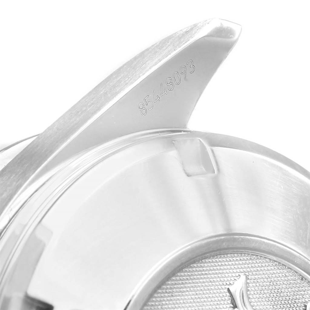 The image shows a close-up of the lug and partial case back of an Omega Speedmaster 3220.50.00 Men
s Stainless Steel Black Dial 3220.50.00 Men
s Stainless Steel Black Dial watch, with a visible serial number.