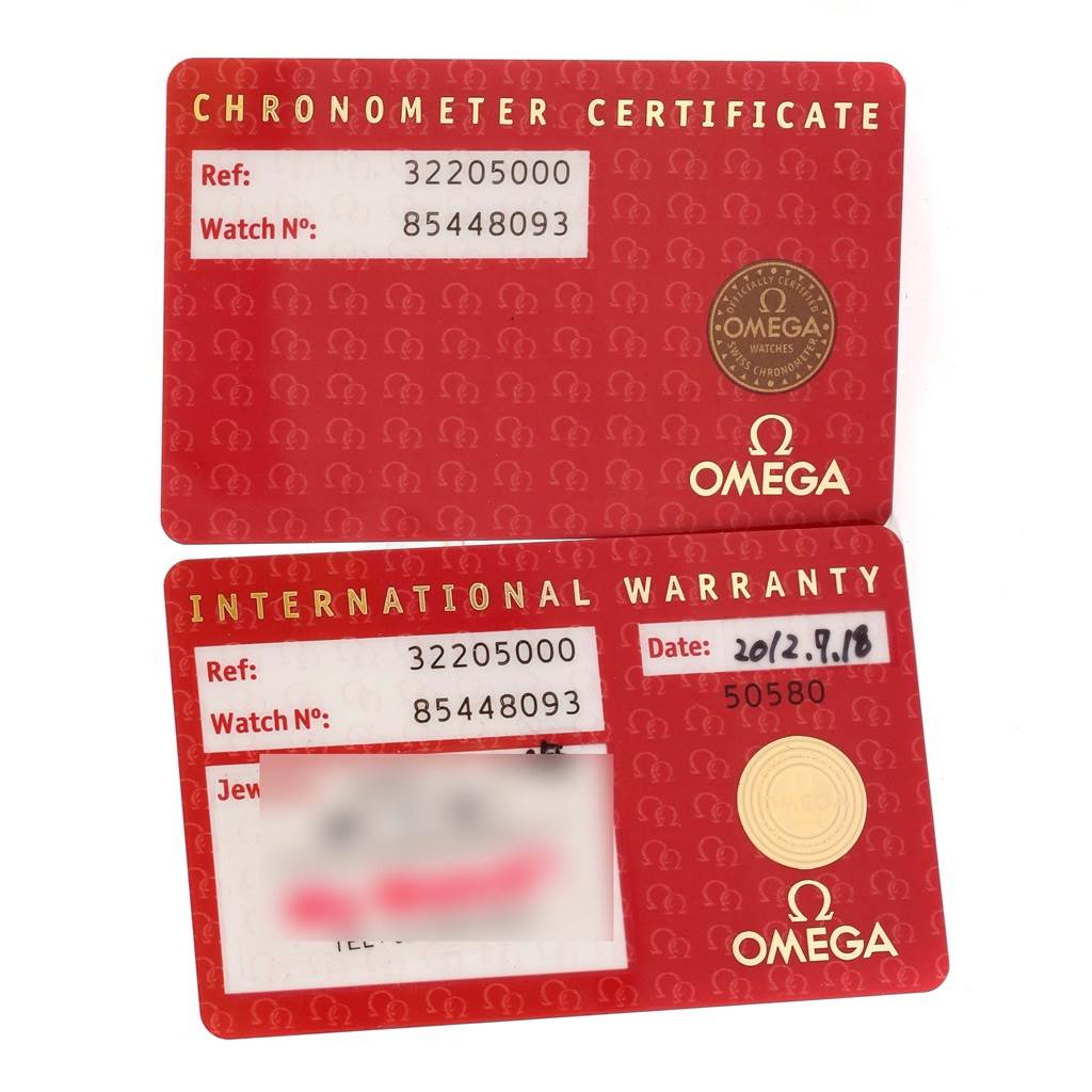 The image shows the Chronometer Certificate and International Warranty cards for the Omega Speedmaster 3220.50.00 Men
s Stainless Steel Black Dial 3220.50.00 Men
s Stainless Steel Black Dial watch model.