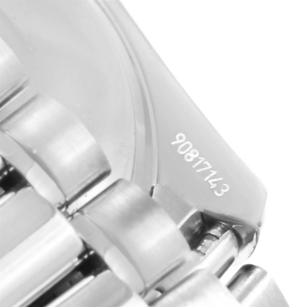 This image shows a close-up of the bracelet link and engraved serial number of an Omega Speedmaster 3539.50.00 Men
s Stainless Steel Black Dial 3539.50.00 Men
s Stainless Steel Black Dial watch.