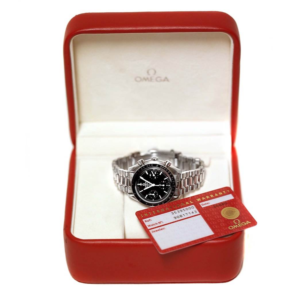 The Omega Speedmaster 3539.50.00 Men
s Stainless Steel Black Dial 3539.50.00 Men
s Stainless Steel Black Dial watch is displayed at a front angle in an open red case next to its warranty card.