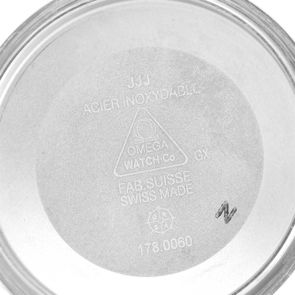 This image shows the inside case back of an Omega Speedmaster 3220.50.00 Men
s Stainless Steel Black Dial 3220.50.00 Men
s Stainless Steel Black Dial watch, with inscriptions indicating its stainless steel composition and model details.